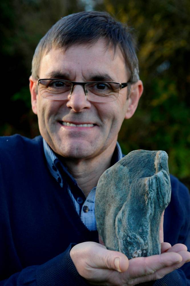 Phil Coby digging dog loo in garden discovers ‘image of Jesus on a rock’
