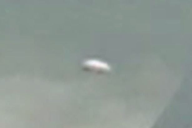 ‘UFO’ spotted over Canberra: Watch footage of strange disc-shaped object filmed above Australian capital